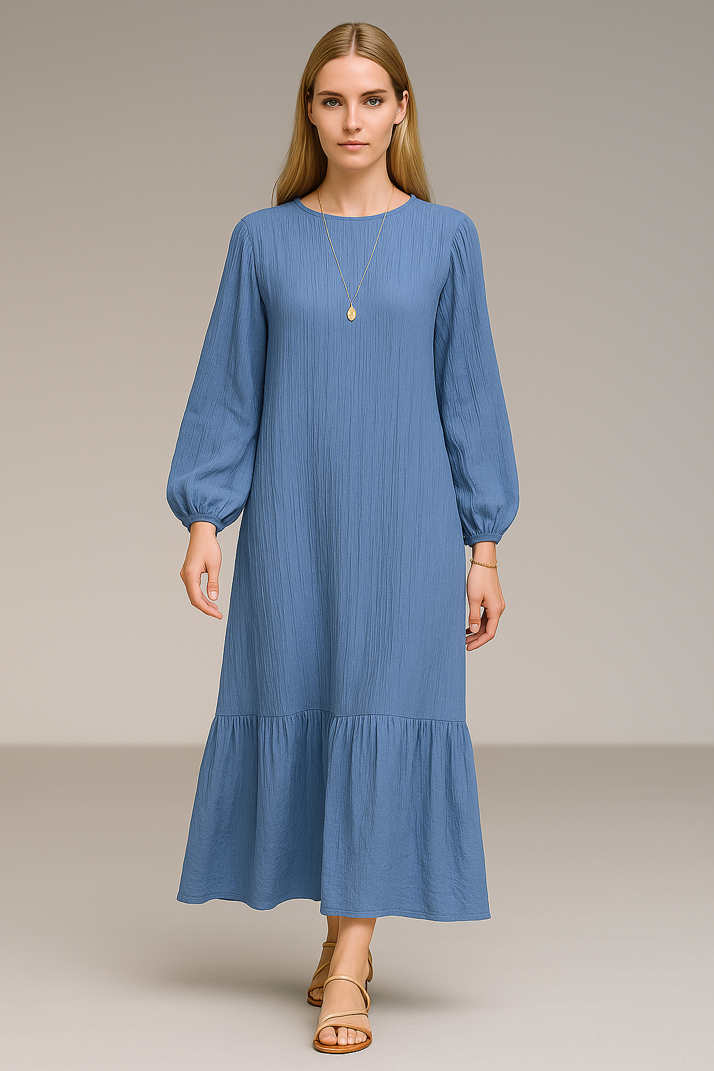 Frontal view of a model wearing the amara maxi dress in Blue.
