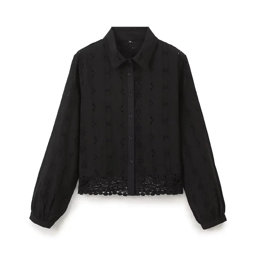 Front view of black Celeste Embroidered Lace Shirt by Noir by Lina, featuring button-down design, balloon sleeves, and delicate floral lace hem