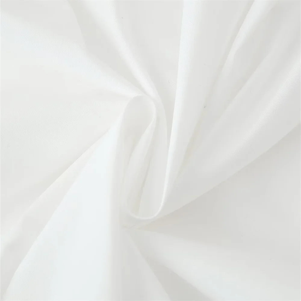 close up fabric detail of the white laurel lace dress