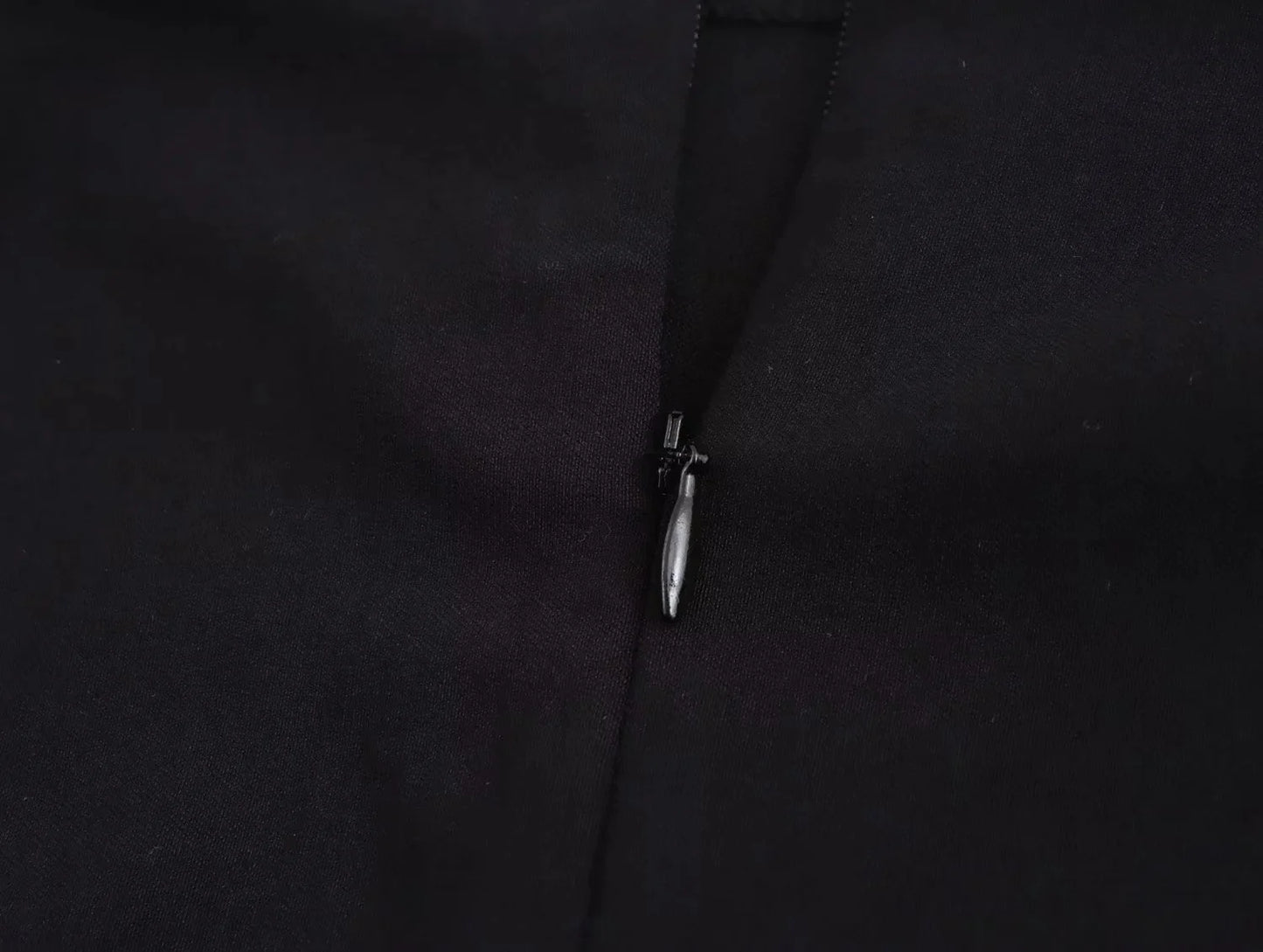 Close-up of a black top zipper detail