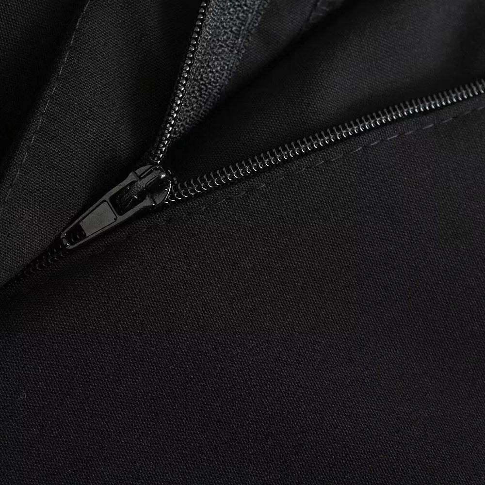 Close-up of concealed zip and stitching on black Noir by Lina classic straight trousers