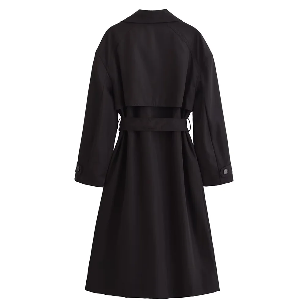 Back view of The Noir Trench coat in black, featuring a turn-down collar, long sleeves, and a belted waist.