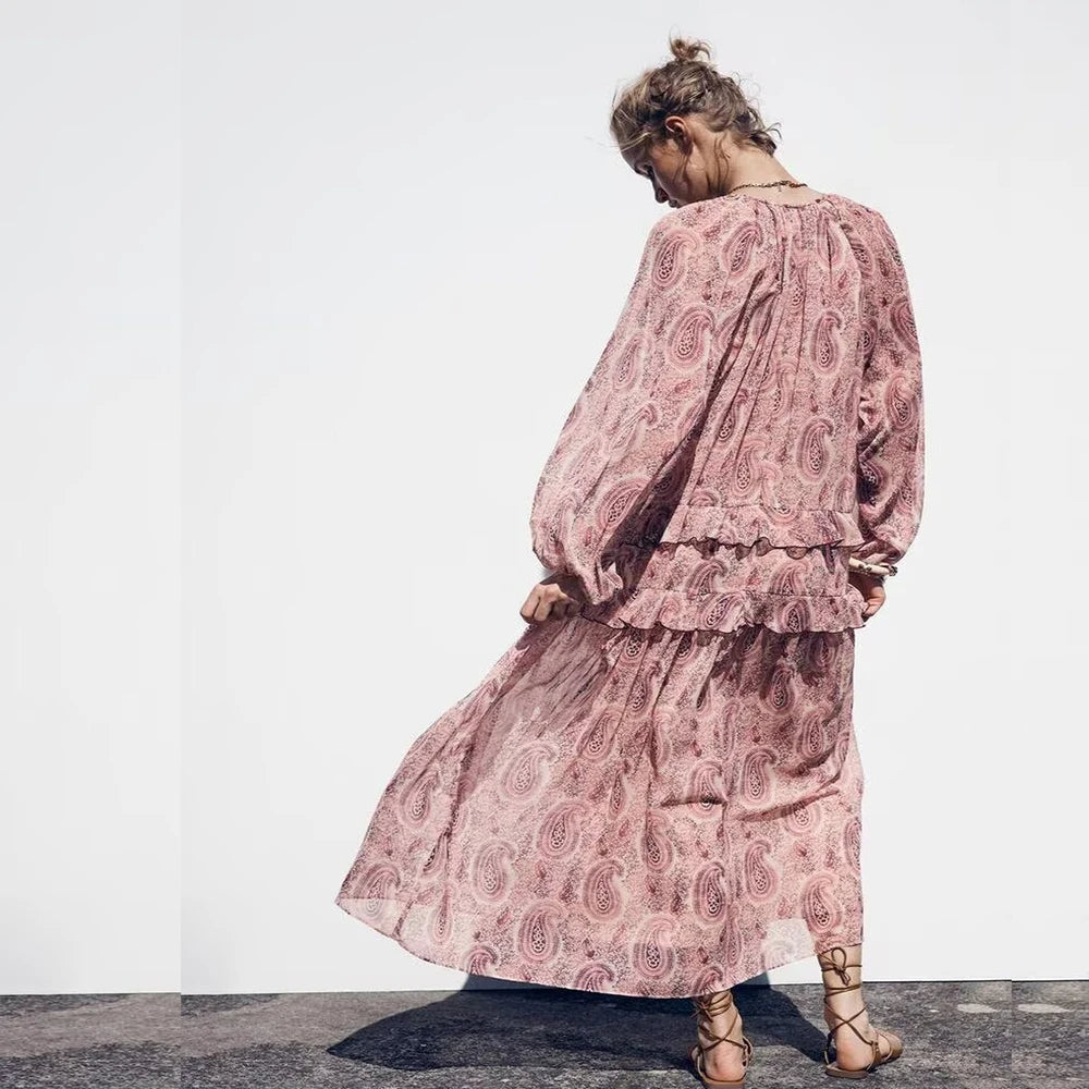 Rear view of model wearing the rosette tiered dress.
