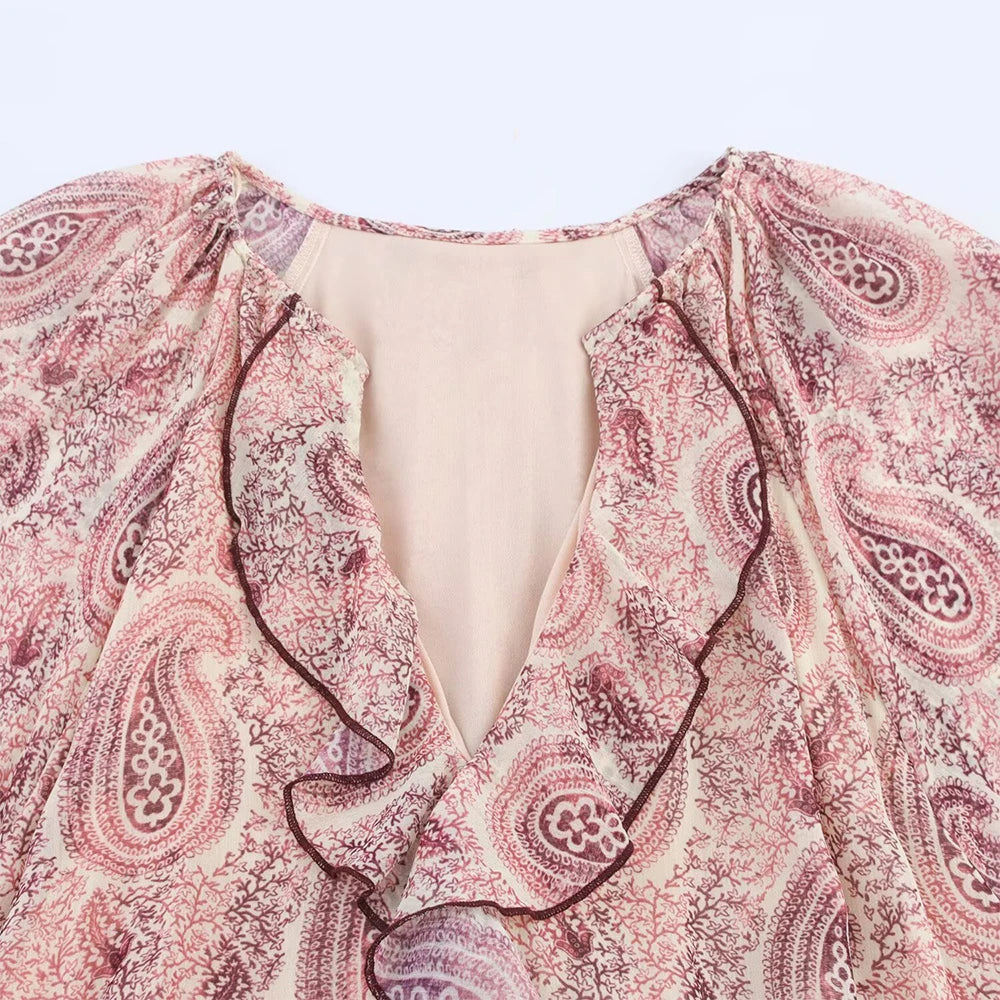 close up of neckline of the rosette tiered dress