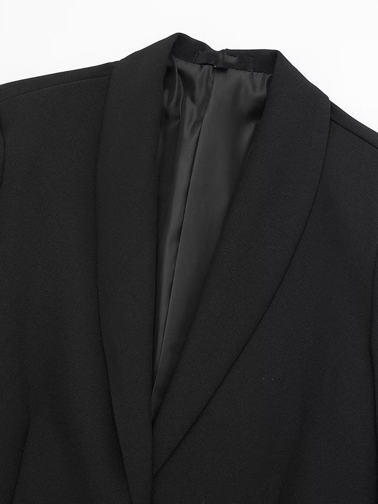 Close-up of sharp lapel and collar structure on black Feather Trim Oversized Blazer by Noir by Lina, showing inner lining and fabric texture
