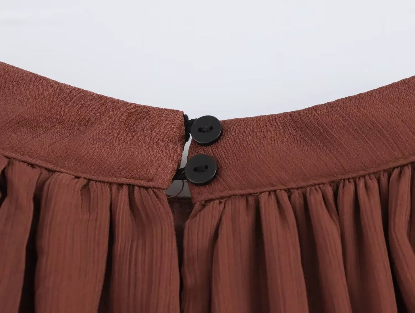 close up neckline button detail of the sienna maxi dress