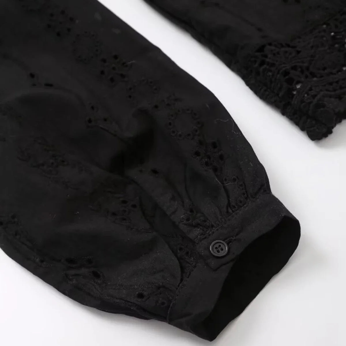 Cuff and sleeve embroidery detail on the black Celeste Embroidered Lace Shirt by Noir by Lina with buttoned closure