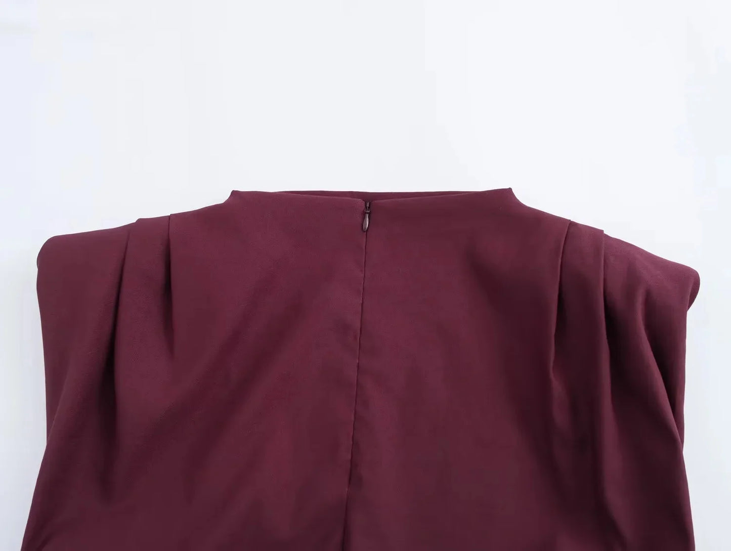 wine red sleeveless top zip closure on a white background