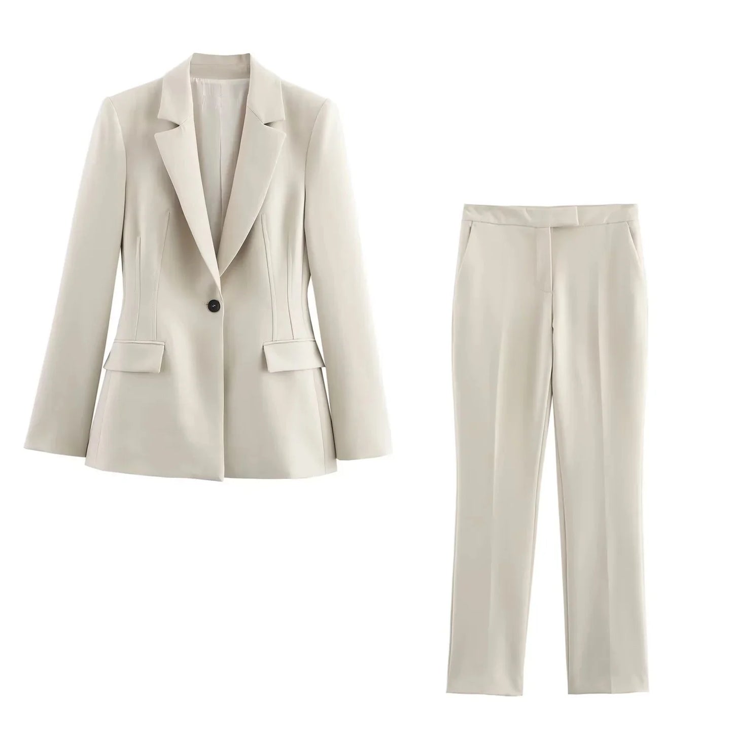 Noir by Lina Valencia Power Suit in white, featuring a single-breasted tailored blazer with lapel collar and slim flared trousers.