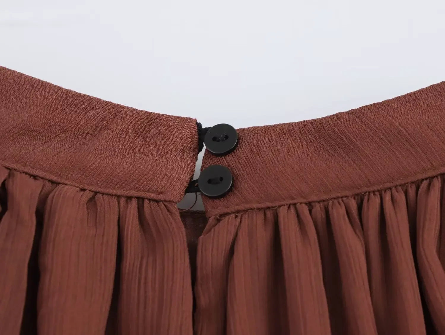 close up neckline button detail of the sienna maxi dress